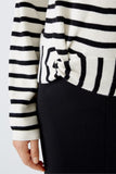 Black and cream striped top with knit detail