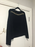 Black sweater with cutout design in gold