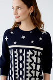 Navy pullover with off white stars and letters design