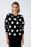 Black knitted hoodie with large polka dots in cream